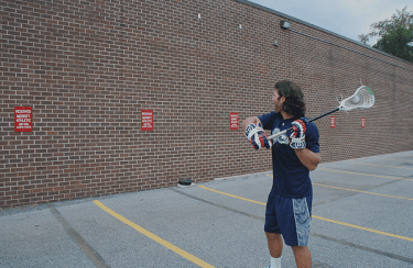 Image of Lacrosse player doing wallball