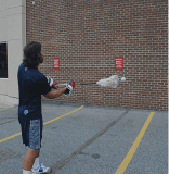 Man playing underhand wall ball